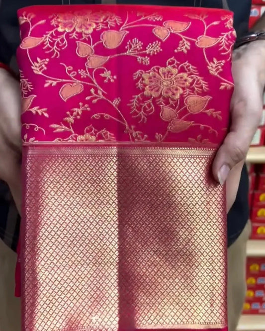 Red floral-patterned fabric held by a person with blurred background