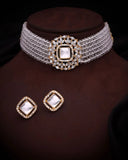 Jewelry set with a choker and earrings on a brown stand